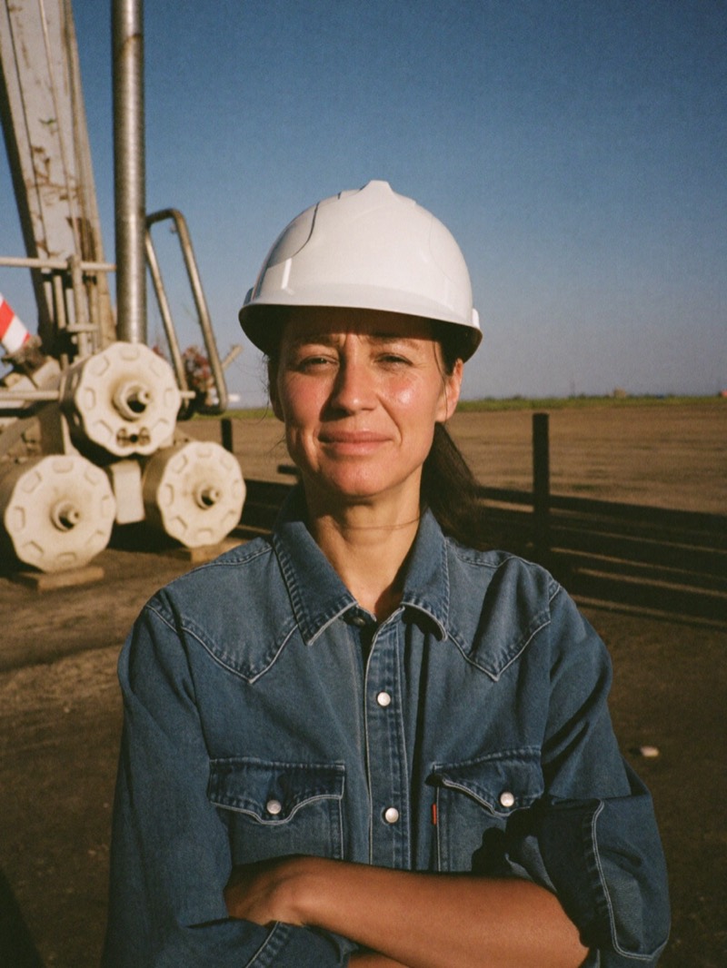 Oil field services owner beside pump equipment